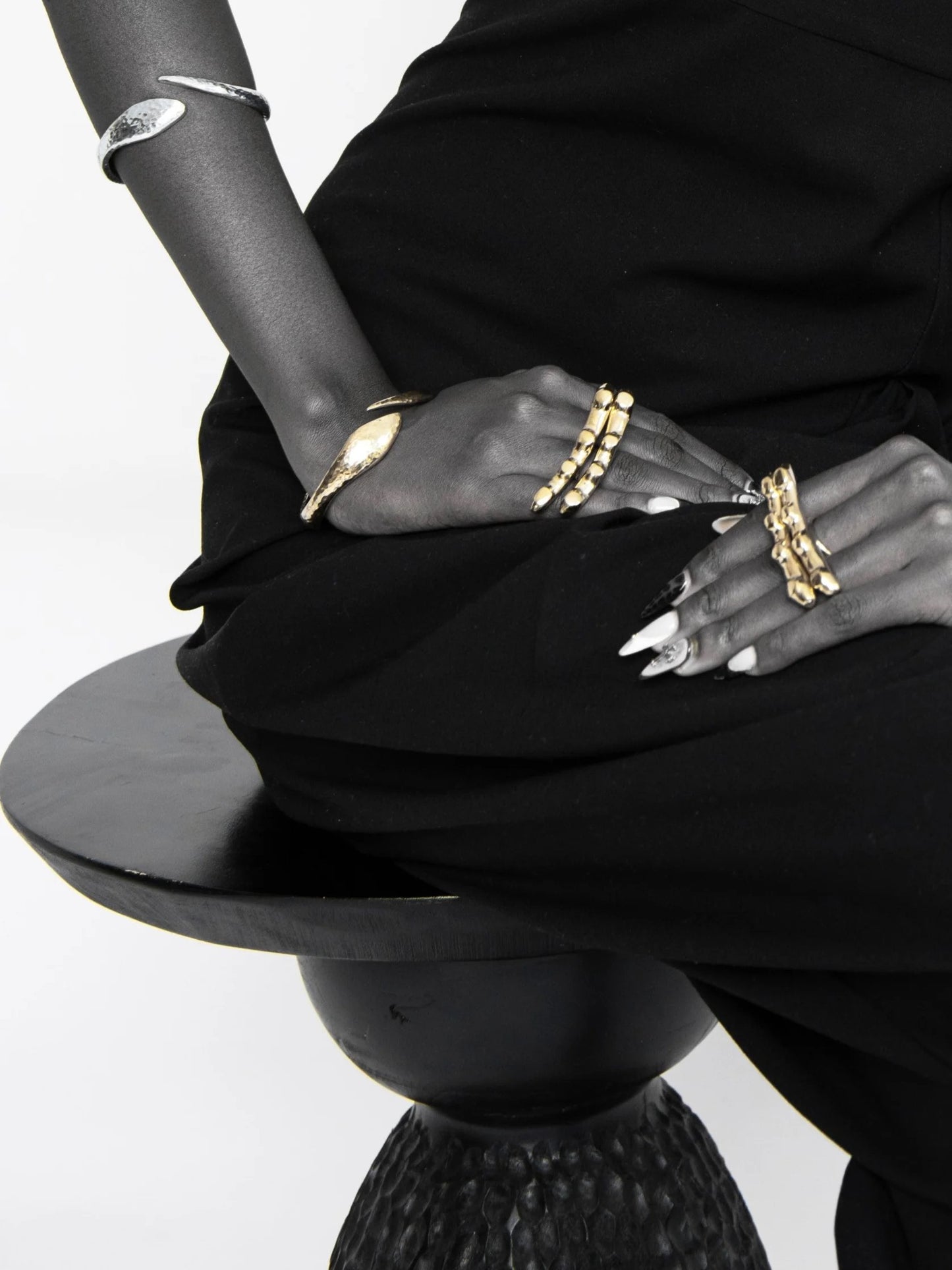 gold ring with a wide wavy bar-like top