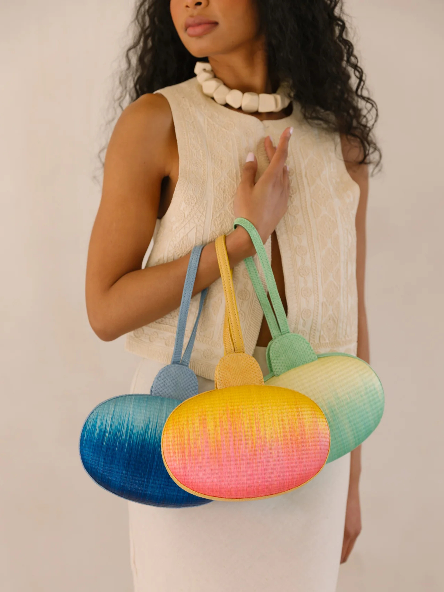 Gradient yellow to pink oval pouch with handle