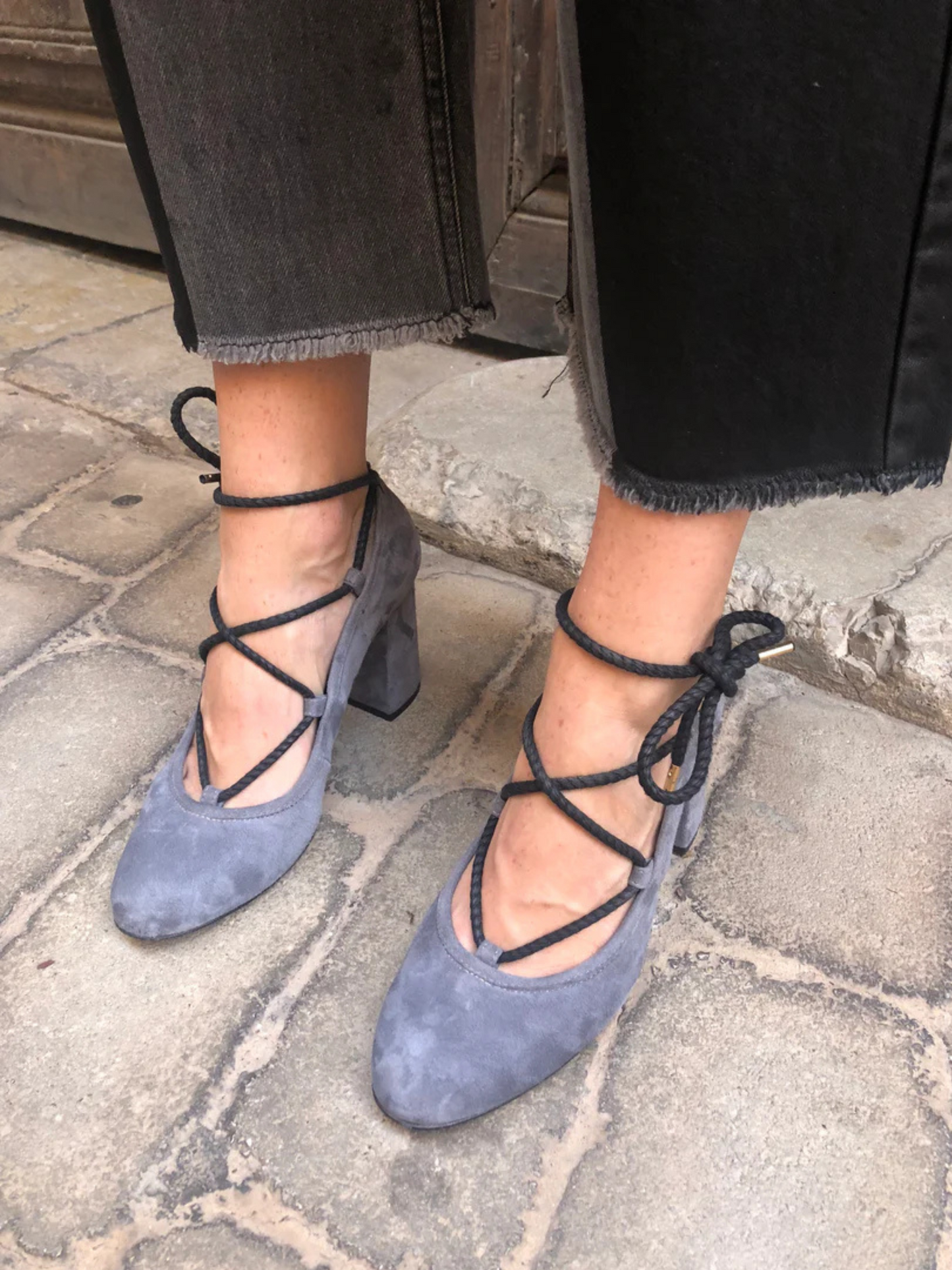 Gray suede high-heeled shoe with black lace up