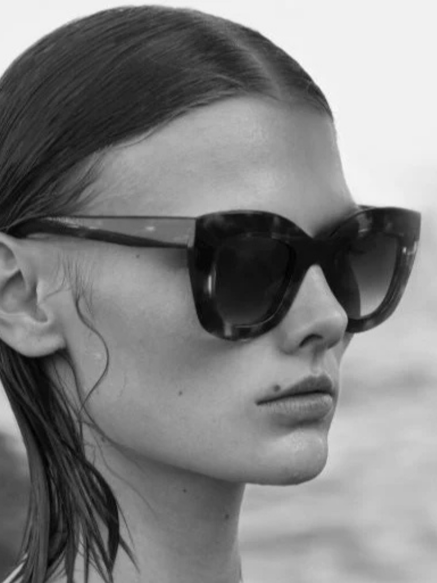 Black cat-eye sunglasses with gray lenses