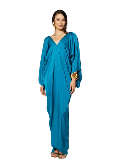 flowing teal-blue caftan-style dress with wide draped sleeves and a deep V-neckline