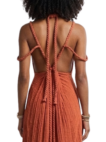  solid-colored gown with spaghetti straps and braided details around the neck and shoulders