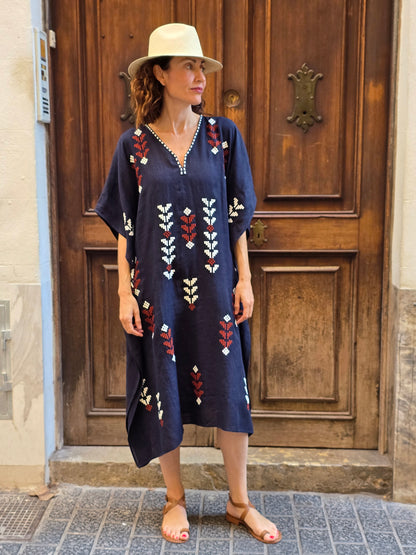 blue dress with white and red embroidery