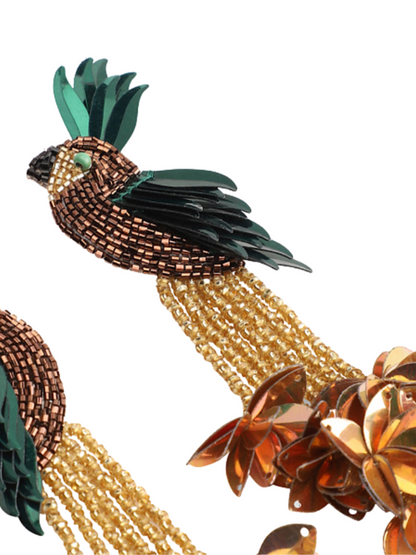 Tropical-themed earrings with parrot figures and beaded floral elements