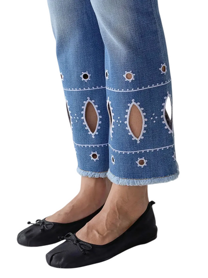 light blue cropped jeans with cutout embroidery details
