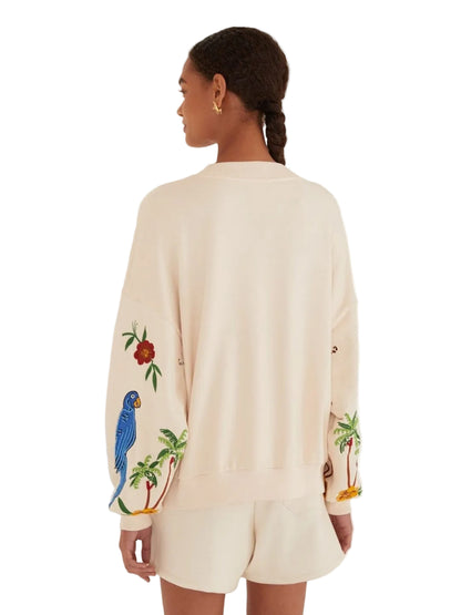 Beige sweatshirt with tropical designs including parrots, toucans, and palm trees