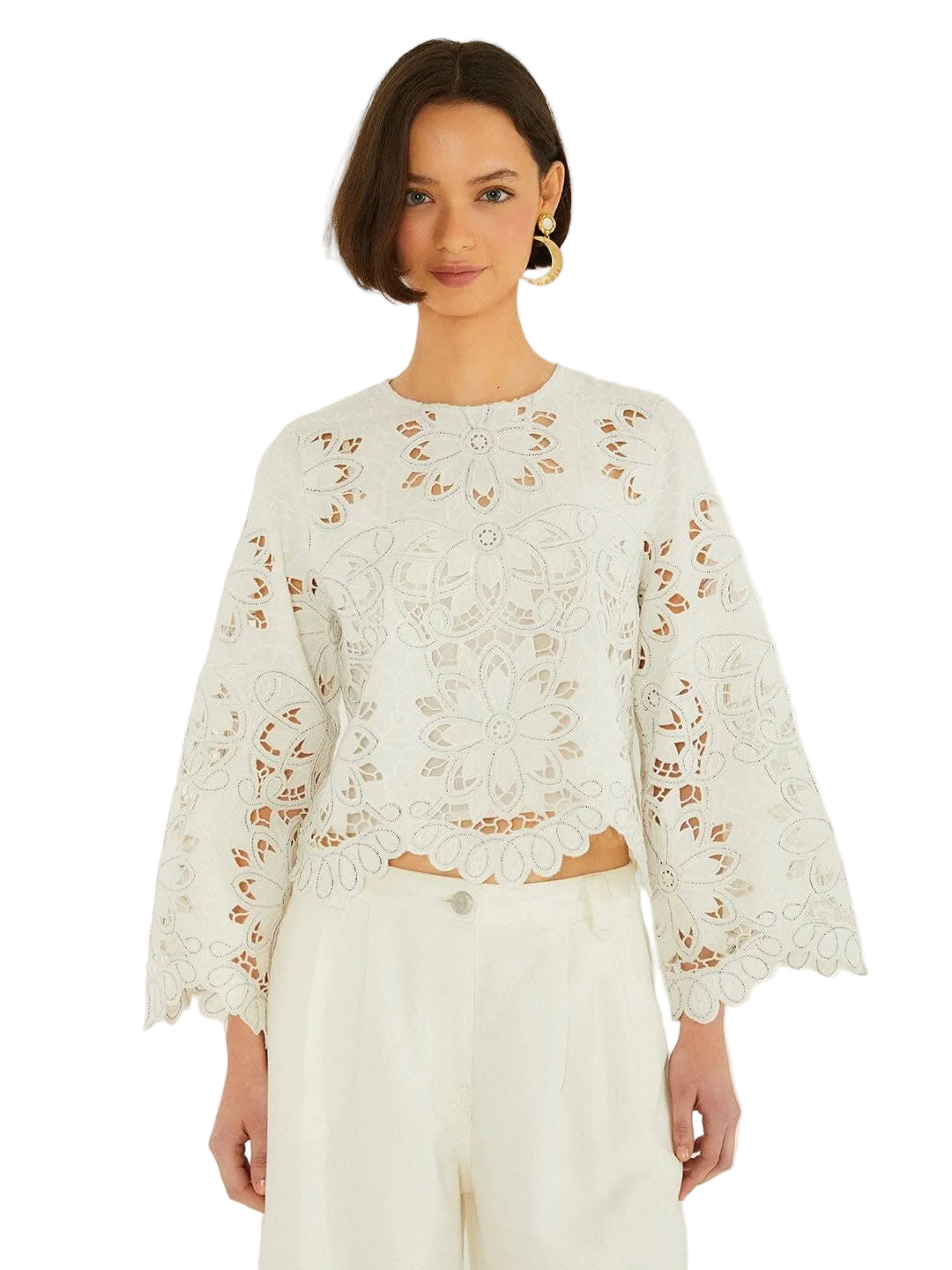 Light-colored embroidered top with floral patterns