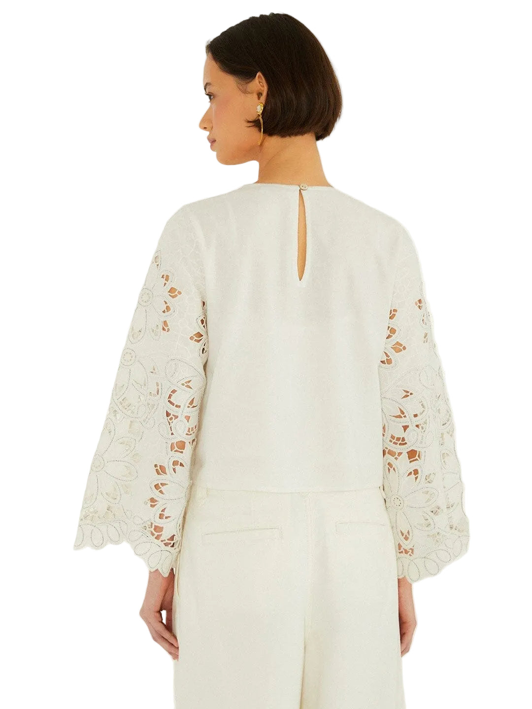 Light-colored embroidered top with floral patterns