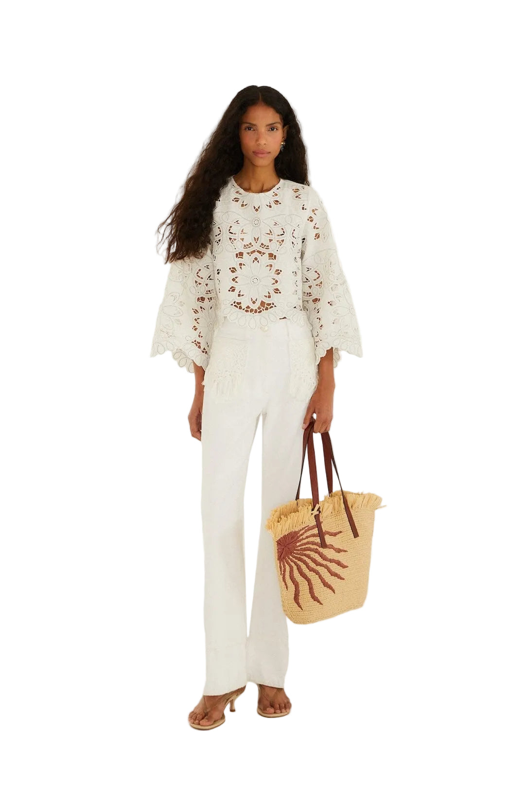 Light-colored embroidered top with floral patterns
