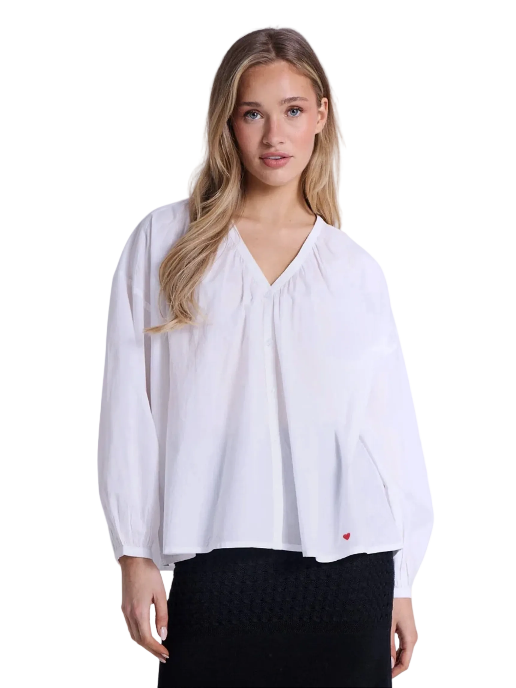 white blouse with a small red heart
