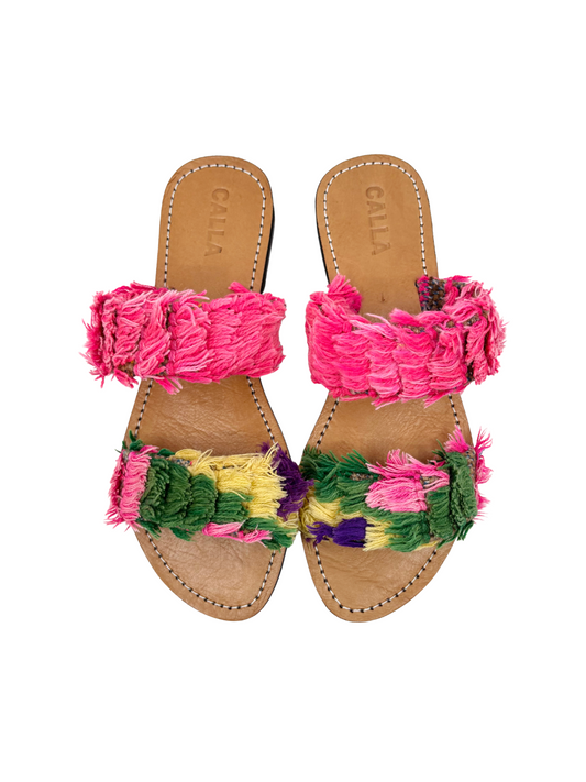  slide sandals featuring vibrant pink fringed straps 