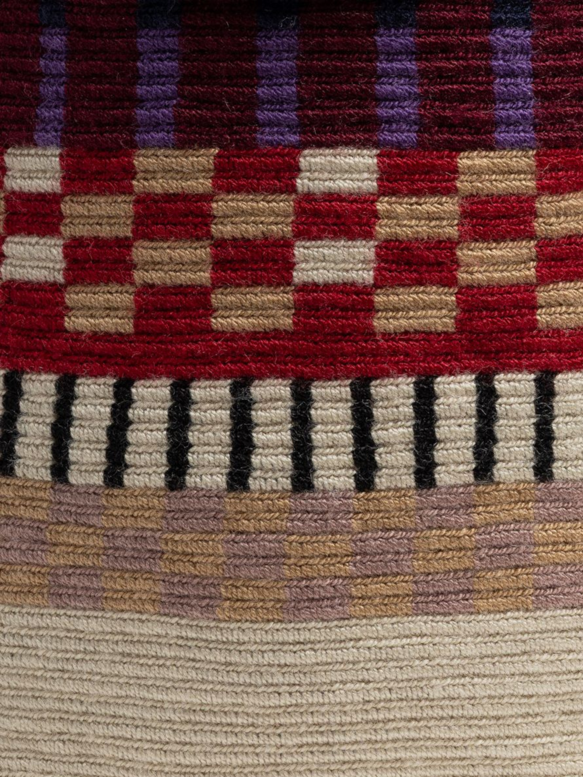 Woven handbag with a braided handle 