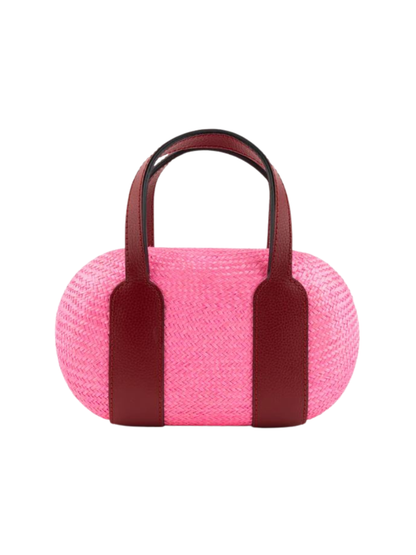 Pink woven handbag with dark red handles 