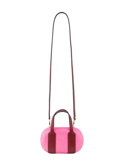 Pink woven handbag with dark red handles 