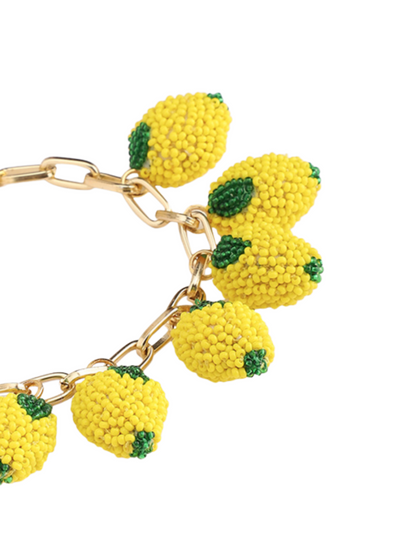 Bracelet with yellow lemon-shaped charms 