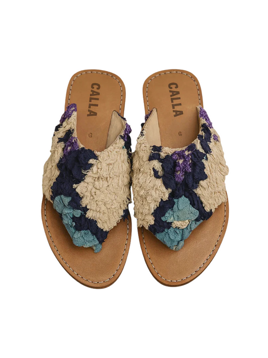 Handmade babouche sandals crafted from upcycled vintage Berber rugs