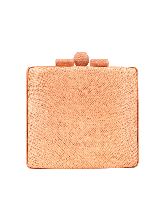 salmon colored clutch bag with a textured surface 