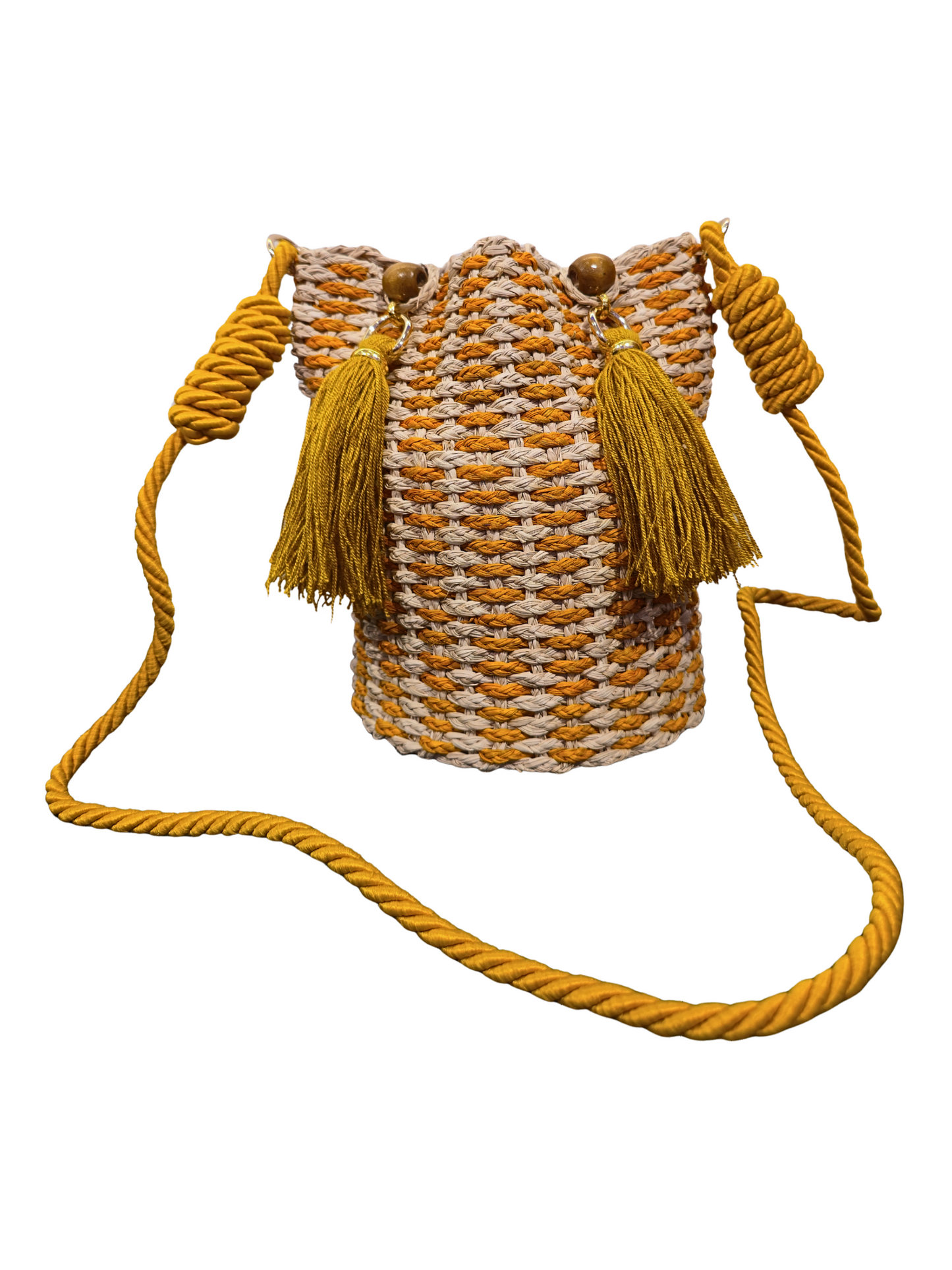 Handwoven iraca bucket bag with sculptural shape and vibrant weave. 