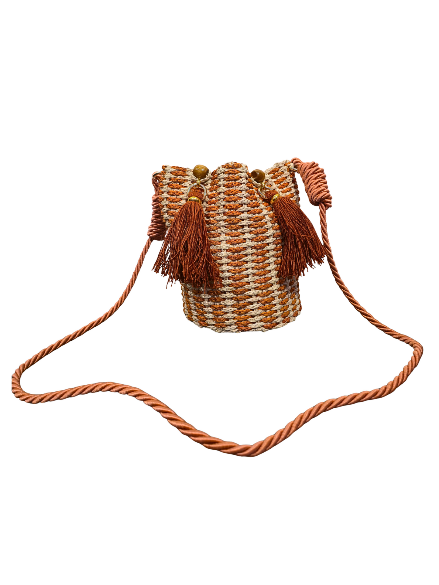 Handwoven iraca bucket bag with sculptural shape and vibrant weave. 