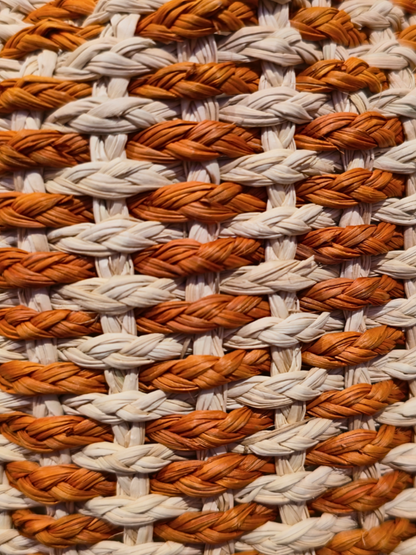 Handwoven iraca bucket bag with sculptural shape and vibrant weave. 