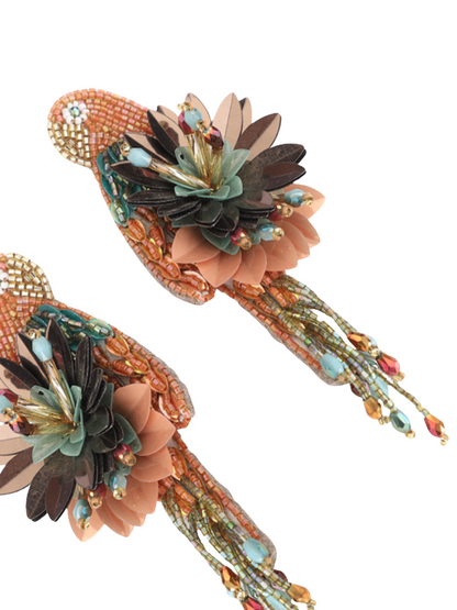 Pair of parrot earrings with floral designs and bead details 