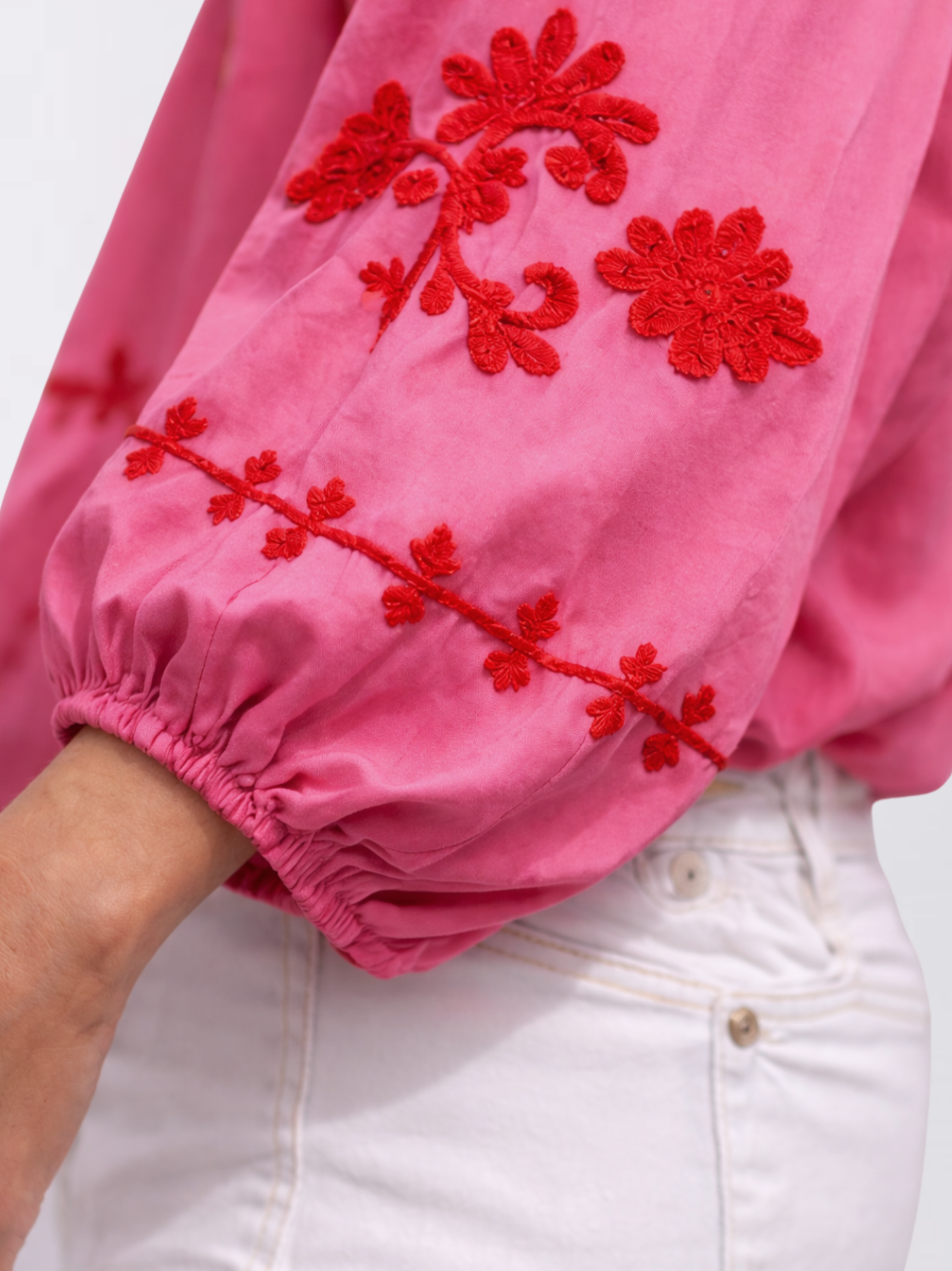 Pink silk blouse with red floral embroidery