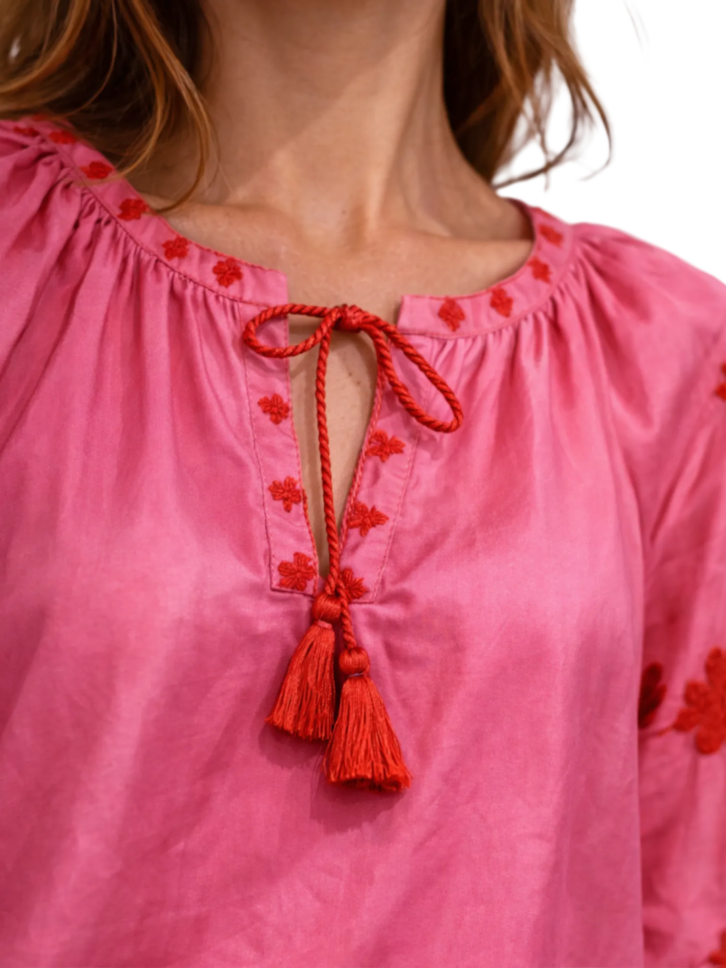 Pink silk blouse with red floral embroidery