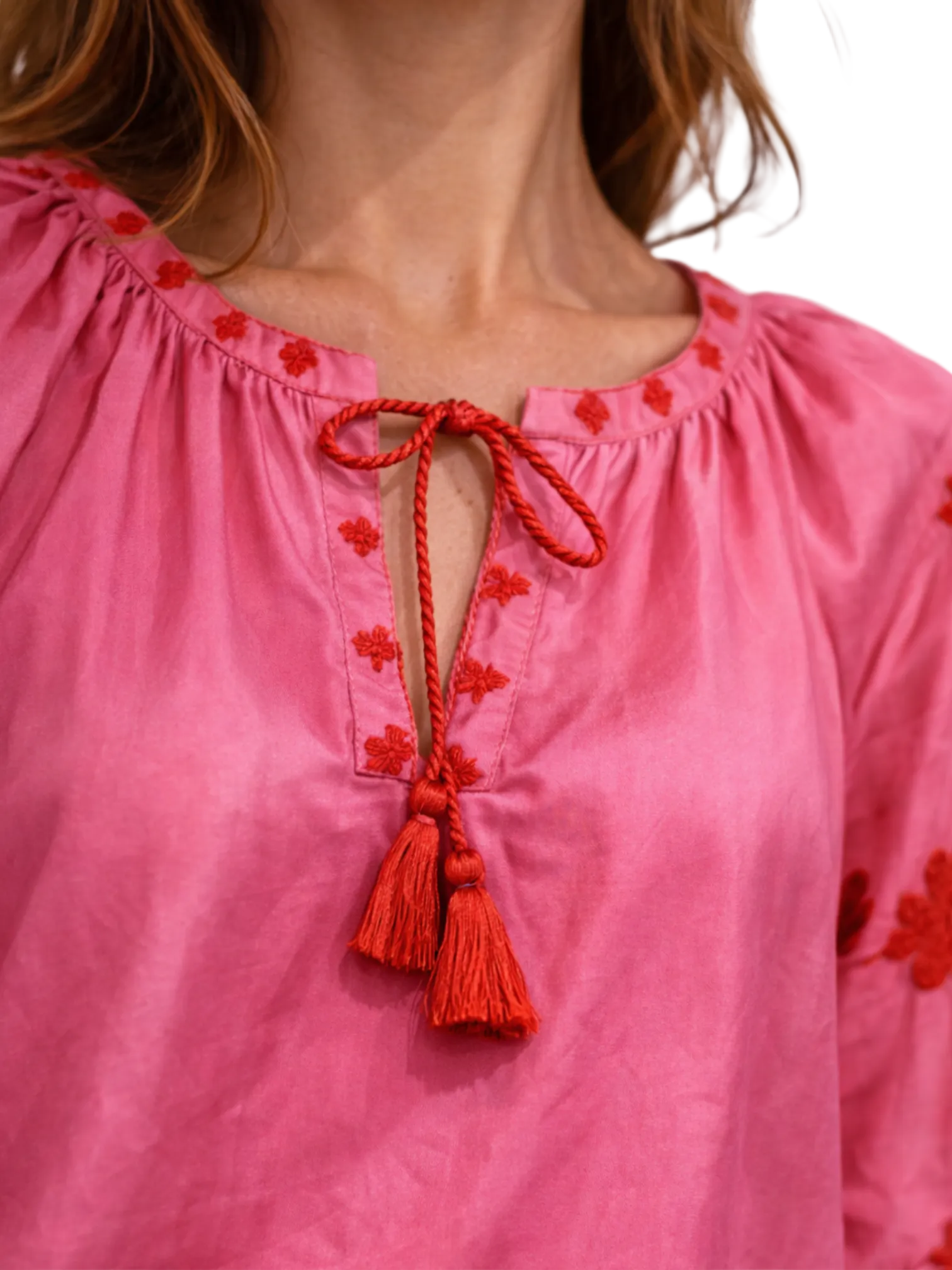 Pink silk blouse with red floral embroidery