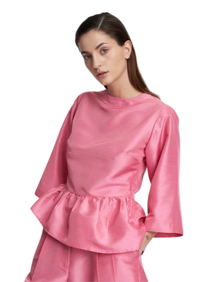Pink open-back top with ruffled details 