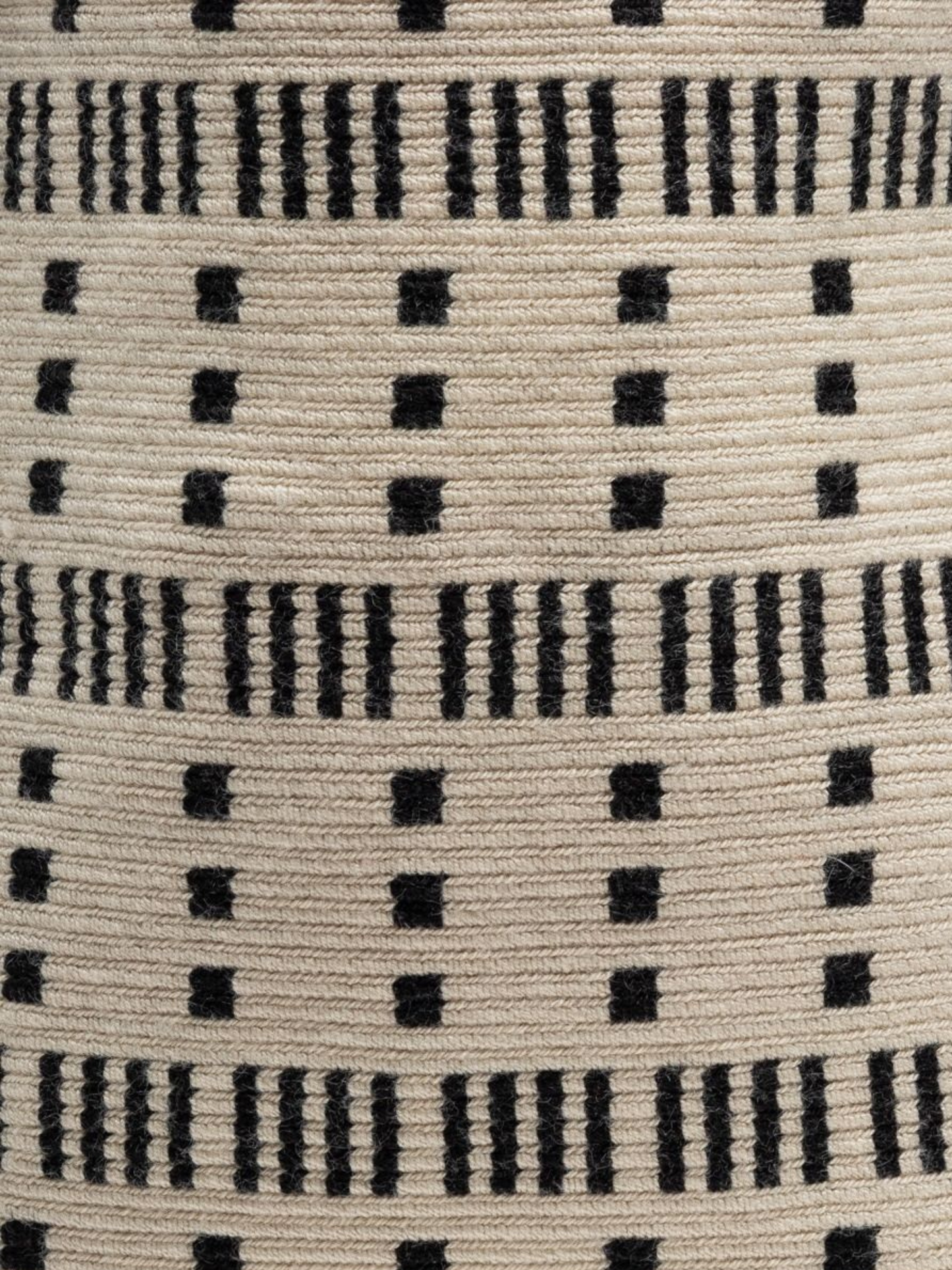 Handbag with black and white pattern and tassels