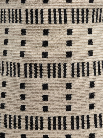 Handbag with black and white pattern and tassels
