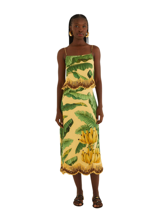 yellow midi skirt with a green banana and palm leaf print, featuring gold fringe 