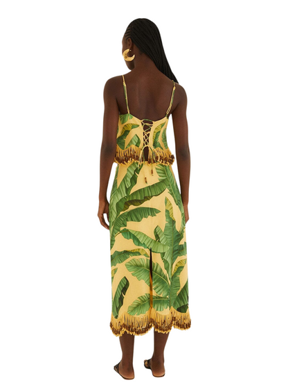 yellow midi skirt with a green banana and palm leaf print, featuring gold fringe 