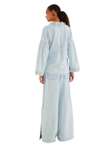 Light blue wide-leg denim pants with decorative lace-up detailing