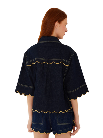 dark indigo denim short-sleeve button-up shirt jacket with yellow contrast stitching and scalloped edges