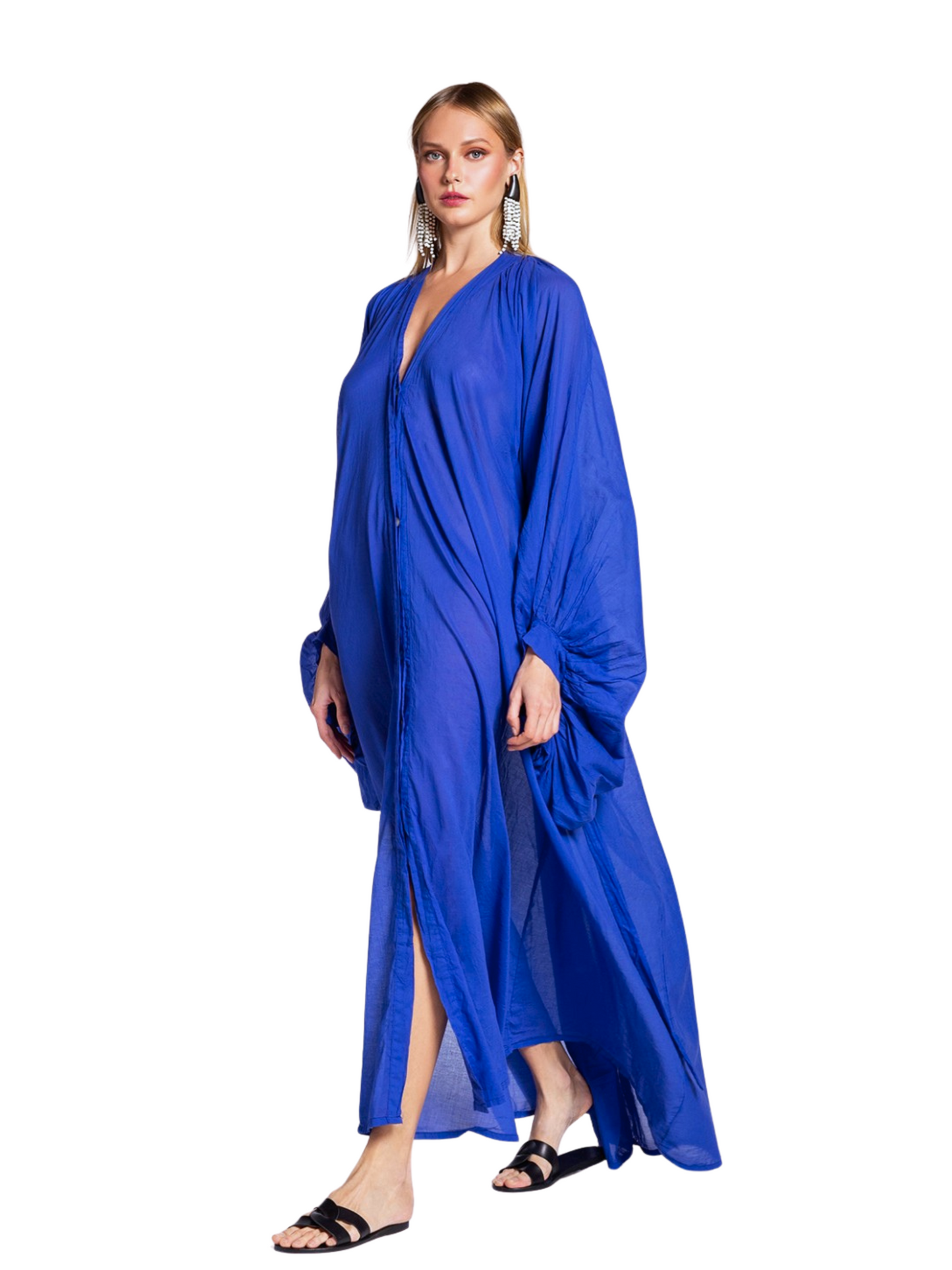 flowing royal blue caftan-style maxi dress with voluminous draped sleeves and a deep V-neckline