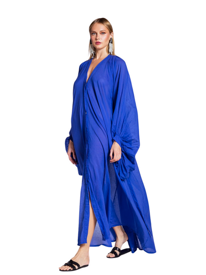 flowing royal blue caftan-style maxi dress with voluminous draped sleeves and a deep V-neckline