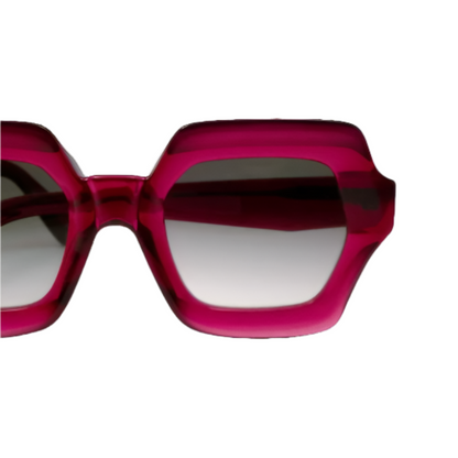 A pair of pink gradient sunglasses with a bold shape