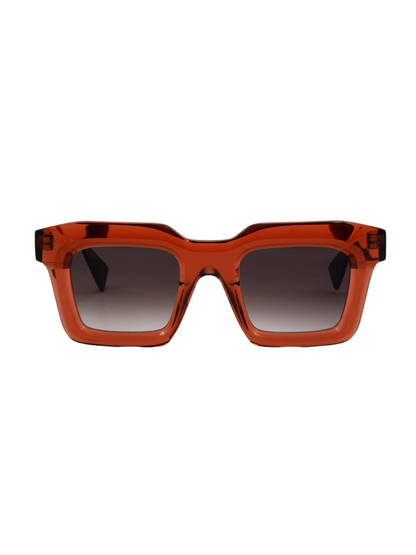 Sunglasses with a transparent brown frame and gradient lenses