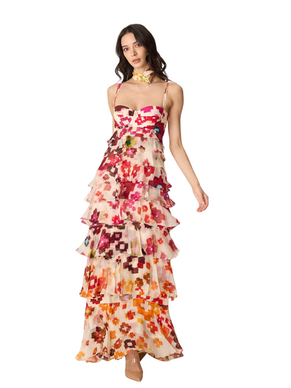  sleeveless, tiered maxi dress with a vibrant floral print on a cream base