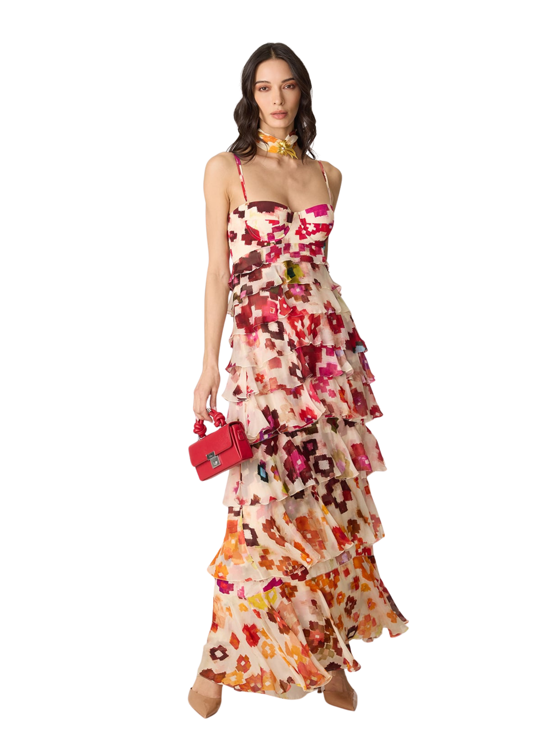  sleeveless, tiered maxi dress with a dense floral print in red, orange, yellow, and green on a light beige base