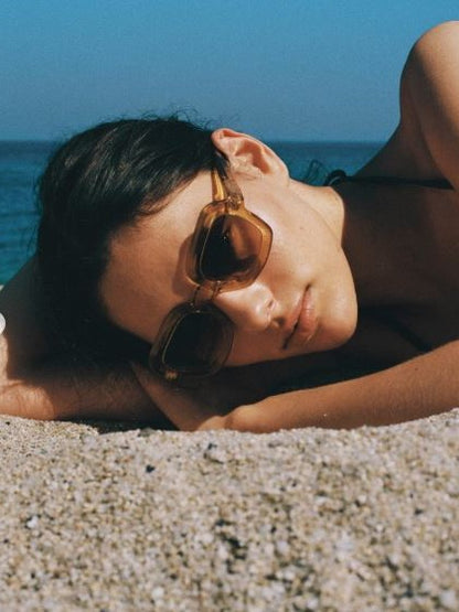 Oversized square sunglasses with a translucent amber-yellow frame