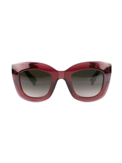sunglasses with a translucent deep red frame and dark gray gradient lenses