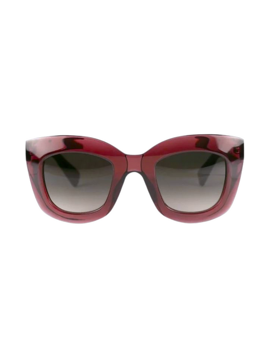 sunglasses with a translucent deep red frame and dark gray gradient lenses