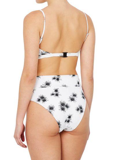 white bikini with a floral print , featuring adjustable straps and a clasp at the back