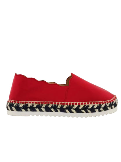 Red slip-on shoe with zebra-patterned sole 