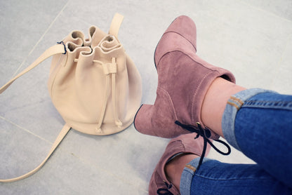 rose-colored suede medium heel booties