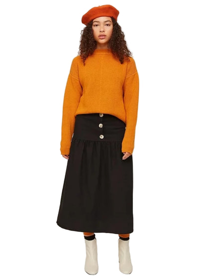  black tiered skirt with a button front closure